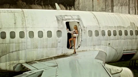 Model posing near airplane Stock Footage 62634444