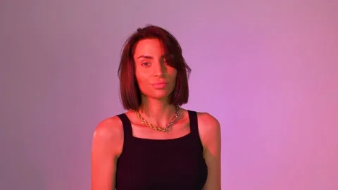 Model posing on pink background Stock Footage 146194150