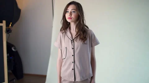 Model posing in pyjama in studio slow motion Stock Footage 62199034