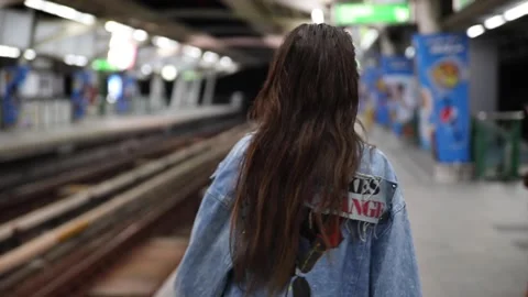 Model is posing on the railway platform Stock Footage 233635849
