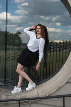 Model posing on a round window Stock Photos