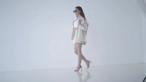 Model posing with sunglasses  in studio Stock Footage 157444777