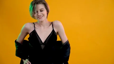 Model posing on yellow background Stock Footage 108053552