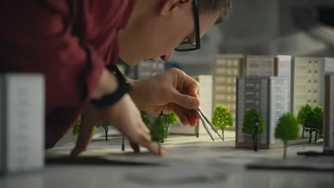 Model. A project engineer uses a tool using a compass to take measurements o Stock Footage 269231442