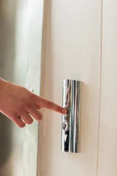 A model pushing elevator button Stock Photos