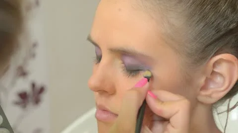 Model putting makeup Stock Footage 12169992
