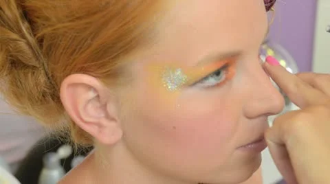 Model putting makeup Stock Footage 12173092