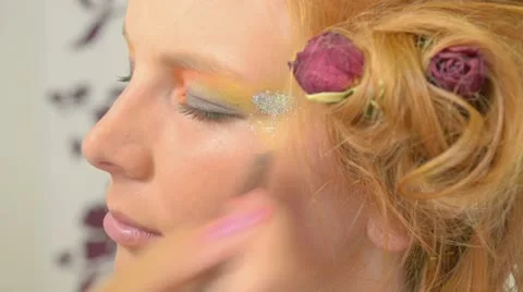 Model putting makeup Stock Footage 12173241