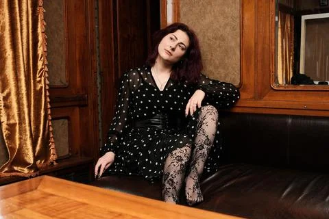 Model radiates elegance and charm in a vintage-inspired setting Stock Photos