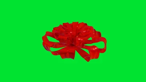Model of red gift bow rotates on green background. 3d render looped animation Stock Footage 312204041