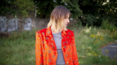 Model with red jacket posing and smiling in camera 스톡 동영상 59737247