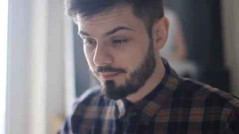 Model released man in studio sneezes and wipes nose in tissue. HD Stock Footage 74062460