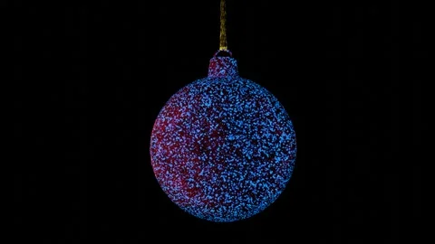 Model of a rotating Christmas tree toy ball with sparkling different particles.  Stock Footage 253873993