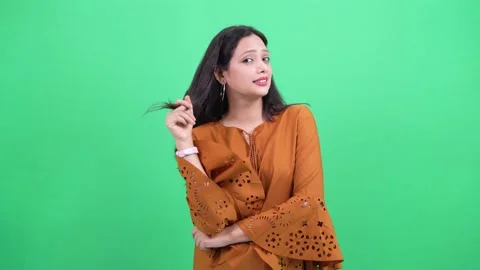 Model running hand through hairs, moving her hairs with hand looking at camera 스톡 동영상 201511642