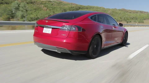 Model S Rear Driving w Pass Stock-Footage 64830765