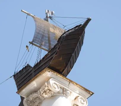 Model of a sailboat on a stone column Stock Photos