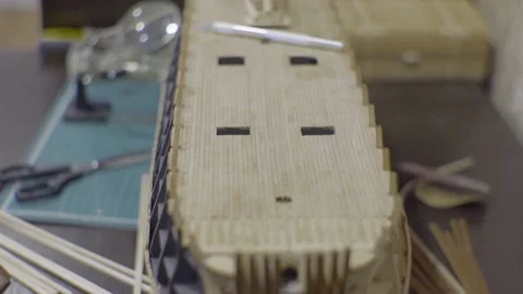 A model of a sailboat under construction with a boat on the deck Video stock 169400783