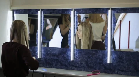 In model school young female is making hairstyle Stock Footage 67722060