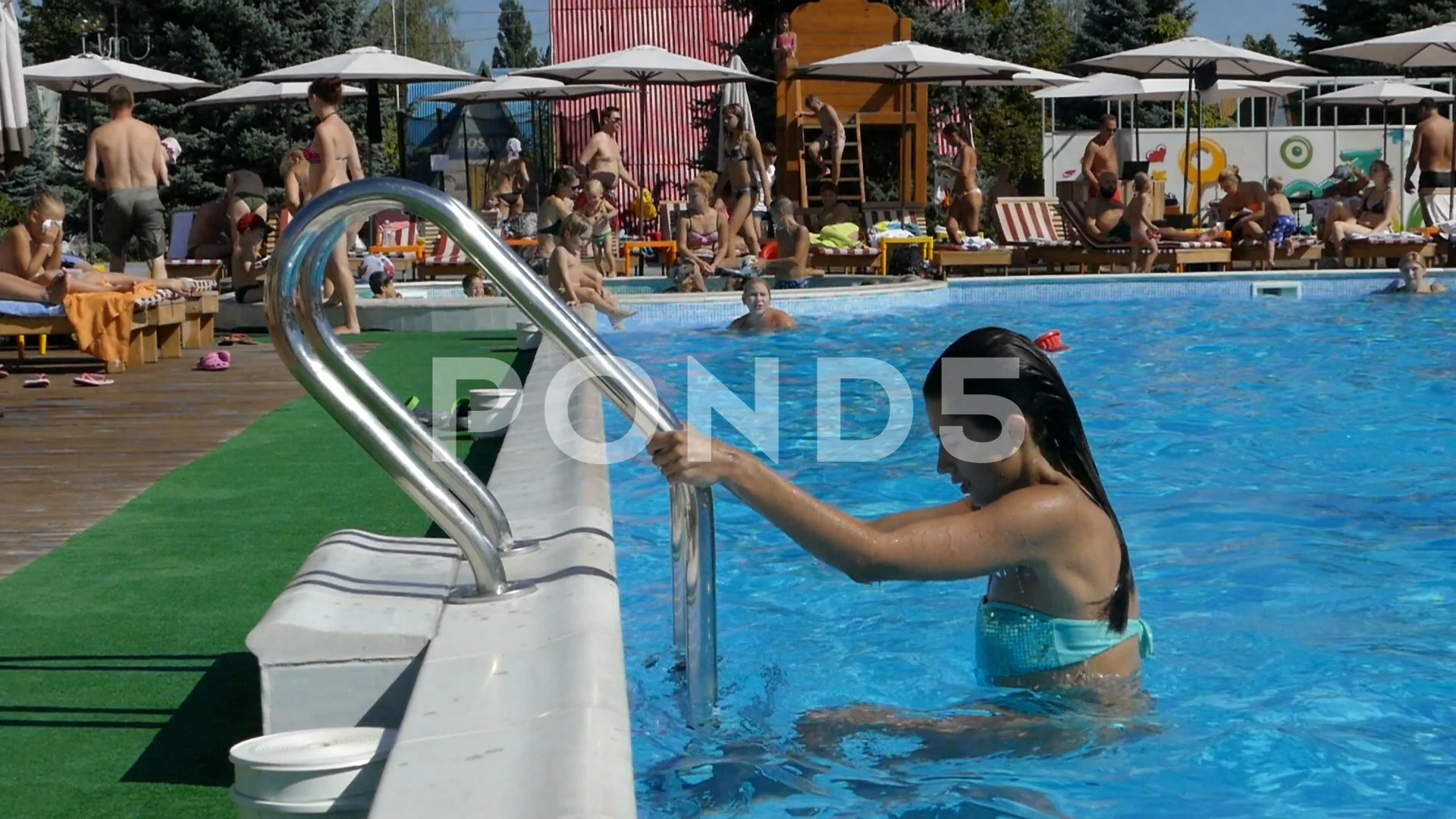 Man posing underwater in swimming pool stock photo