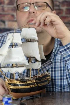Model Ship Building handcraft on table with different materials Stock Photos