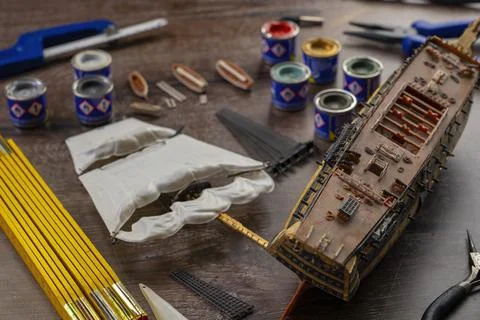 Model Ship Building handcraft on table with different materials Stock Photos