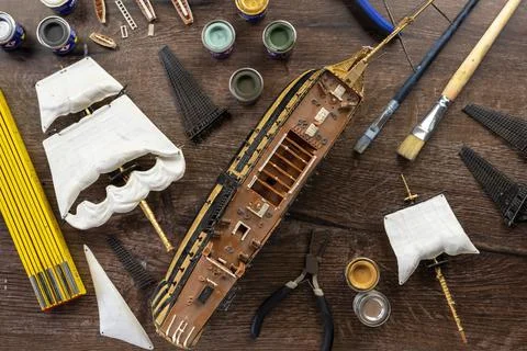 Model Ship Building handcraft on table with different materials Stock Photos