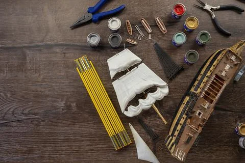 Model Ship Building handcraft on table with different materials Stock Photos