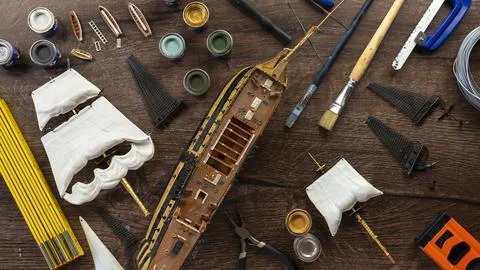 Model Ship Building handcraft on table with different materials Stock Photos