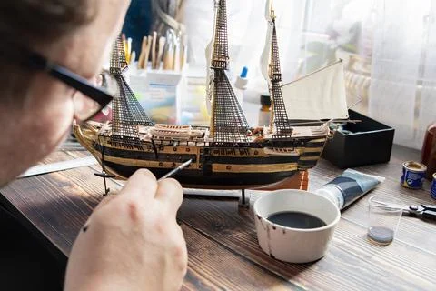 Model Ship Building handcraft on table with different materials Stock Photos
