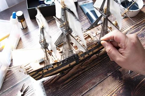 Model Ship Building handcraft on table with different materials Stock Photos