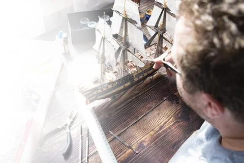 Model Ship Building handcraft on table with different materials Stock Photos