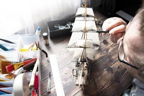 Model Ship Building handcraft on table with different materials Stock Photos