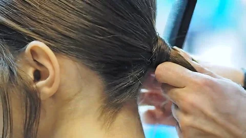 The model shows where it makes her uncomfortable for hair dresser on the 스톡 동영상 69077651