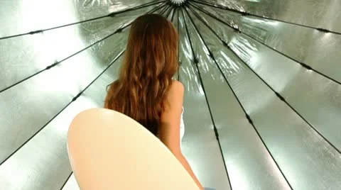 Model sit on chair, she turn around and back, in photo studio Stock Footage 10568221