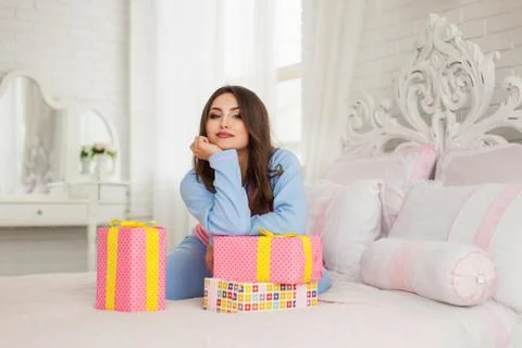 Model sitting with New Year presents Stock Photos