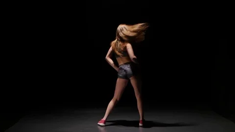 Model with slender body dancing twerk her buttocks in studio Stock Footage 73023762