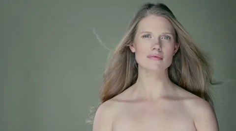Model standing in studio with wind blowing her long hair. Stock Footage 63031962