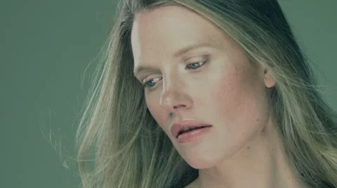 Model standing in studio with wind blowing her long hair. Stock Footage 63032597