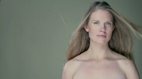Model standing in studio with wind blowing her long hair. Stock Footage 63032603