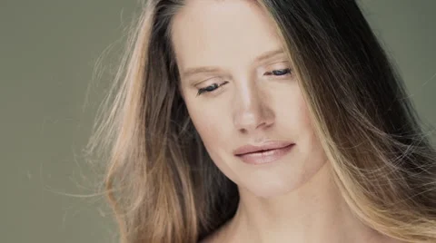 Model standing in studio with wind blowing her long hair. Stock Footage 63032651