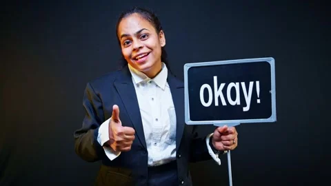 Model stands smiling with template gesturing all fine Stock Footage 303129910