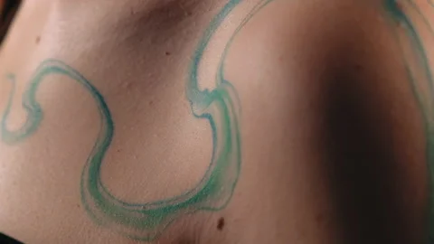 The model stands in the studio and shows a tattoo Stock Footage 184244762