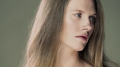 Model in studio turns her head to look towards the camera. Stock Footage 63032547