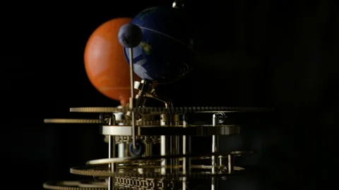 Model of the sun, earth and moon in miniature. Rotation of the earth around the Видео 102896953