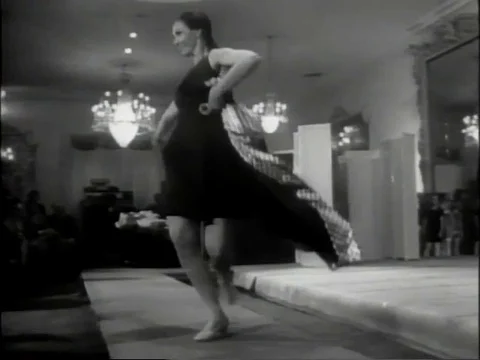 Model takes off coat and dances 1960s archival footage Stock Footage 77657553