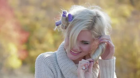Model Takes Curlers Off Stock Footage 22305992