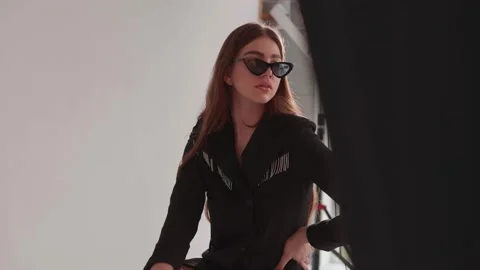 Model taking photo in studio Stock Footage 171758614