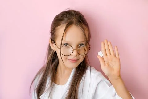 A model of a tooth in the hands of a child. Stock Photos