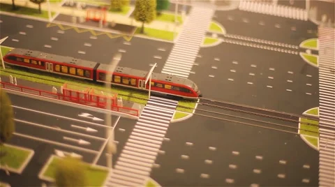 Model train moving on the layout of the city Stock Footage 46360504