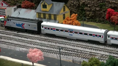 Model Train Moving from Station Stock Footage 39504426